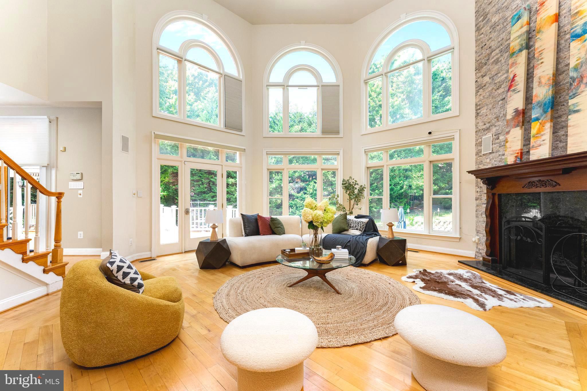 1445 Mayhurst Boulevard McLean, VA 22102 - Photo 5 of 31 a living room with fireplace furniture and a large window