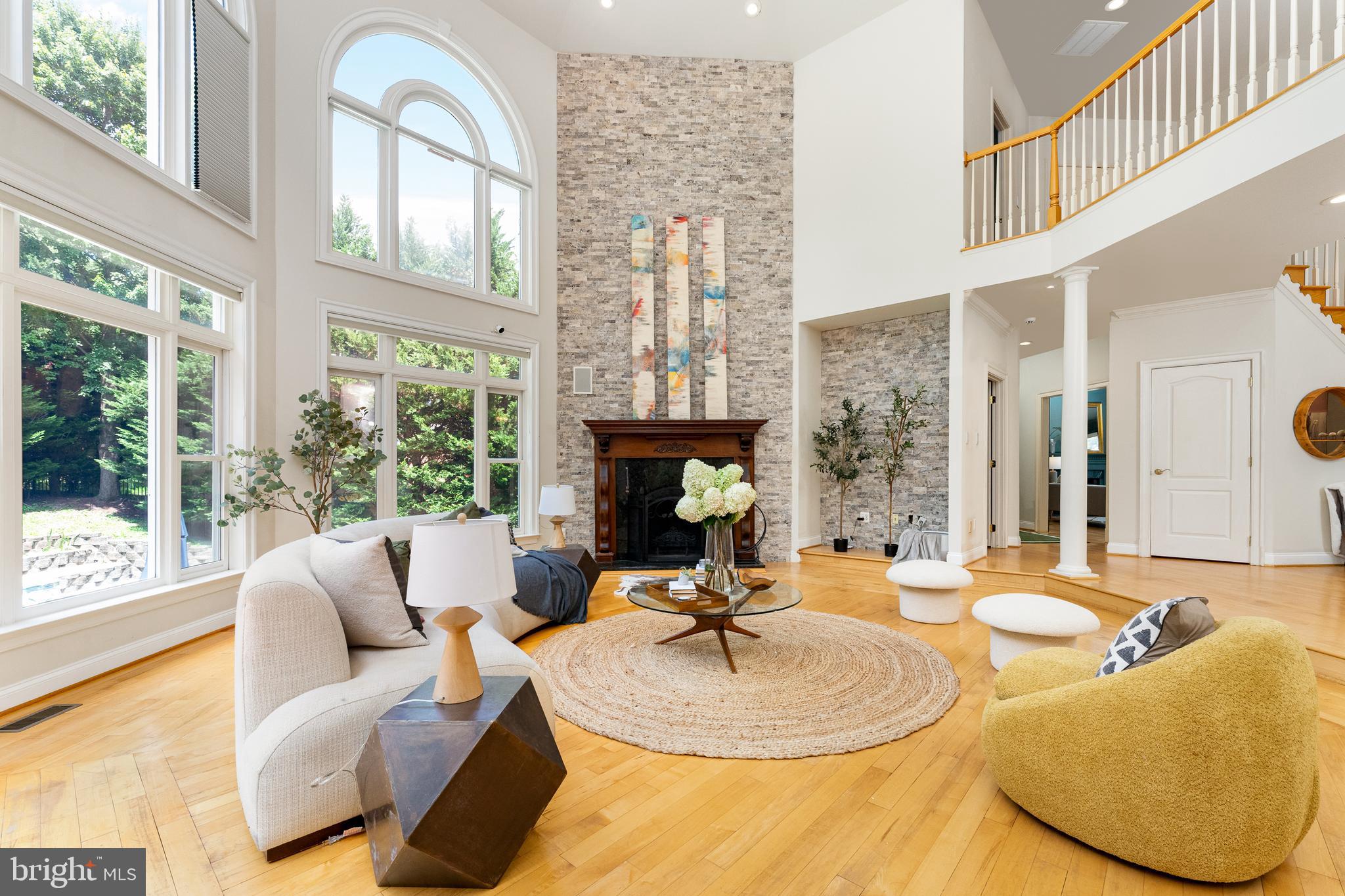 1445 Mayhurst Boulevard McLean, VA 22102 - Photo 6 of 31 a living room with fireplace furniture and a large window