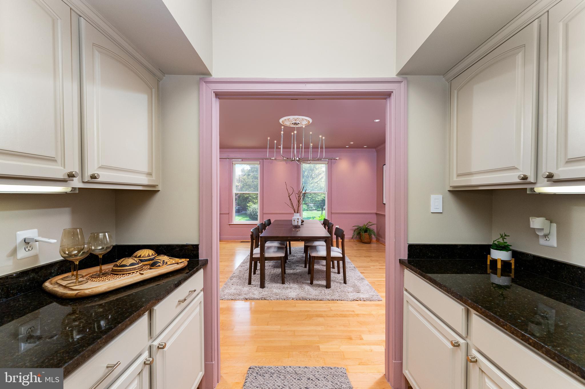 1445 Mayhurst Boulevard McLean, VA 22102 - Photo 10 of 31 a kitchen with stainless steel appliances granite countertop a stove and a white cabinets