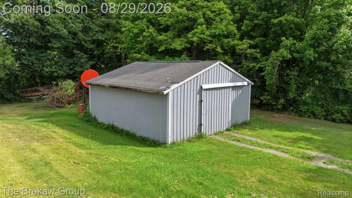 5411 Hess Road Dryden, MI 48428 - Photo 42 of 56 Storage shed with a pitched roof and vertical siding