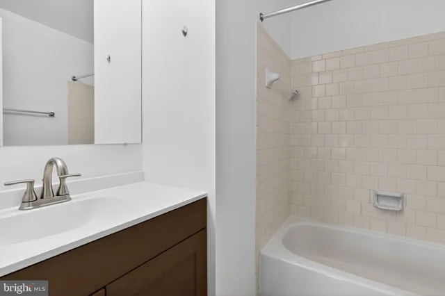 a balcony with wooden floor and fence