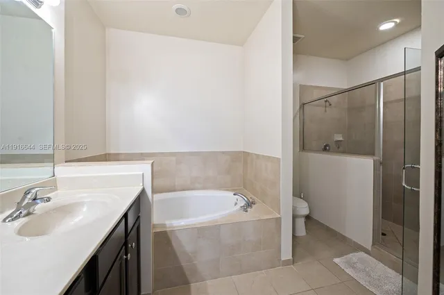 a bathroom with a bathtub and a sink