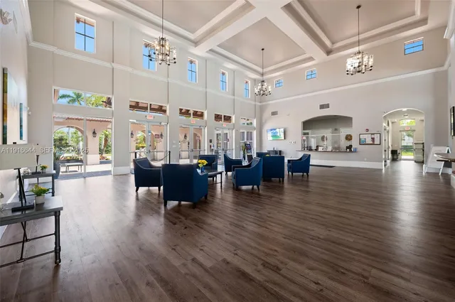 a living room with fireplace furniture and a wooden floor