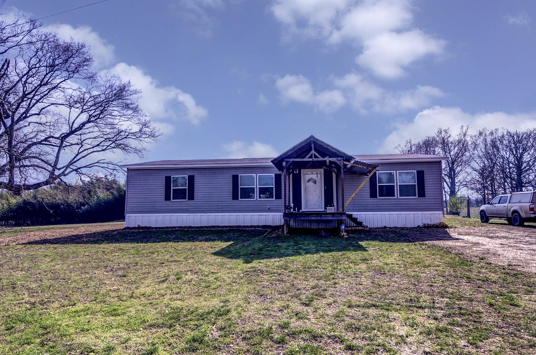 2450 South Neely Road Middleton, TN 38052 - Photo 2 of 36 a front view of a house with a yard