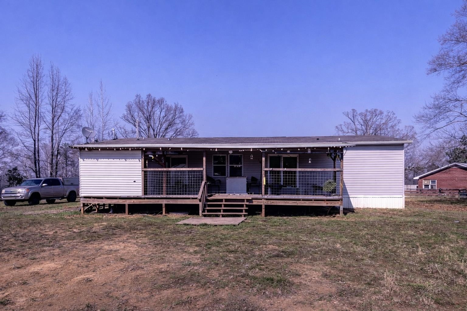 2450 South Neely Road Middleton, TN 38052 - Photo 34 of 36 a front view of a house with a yard