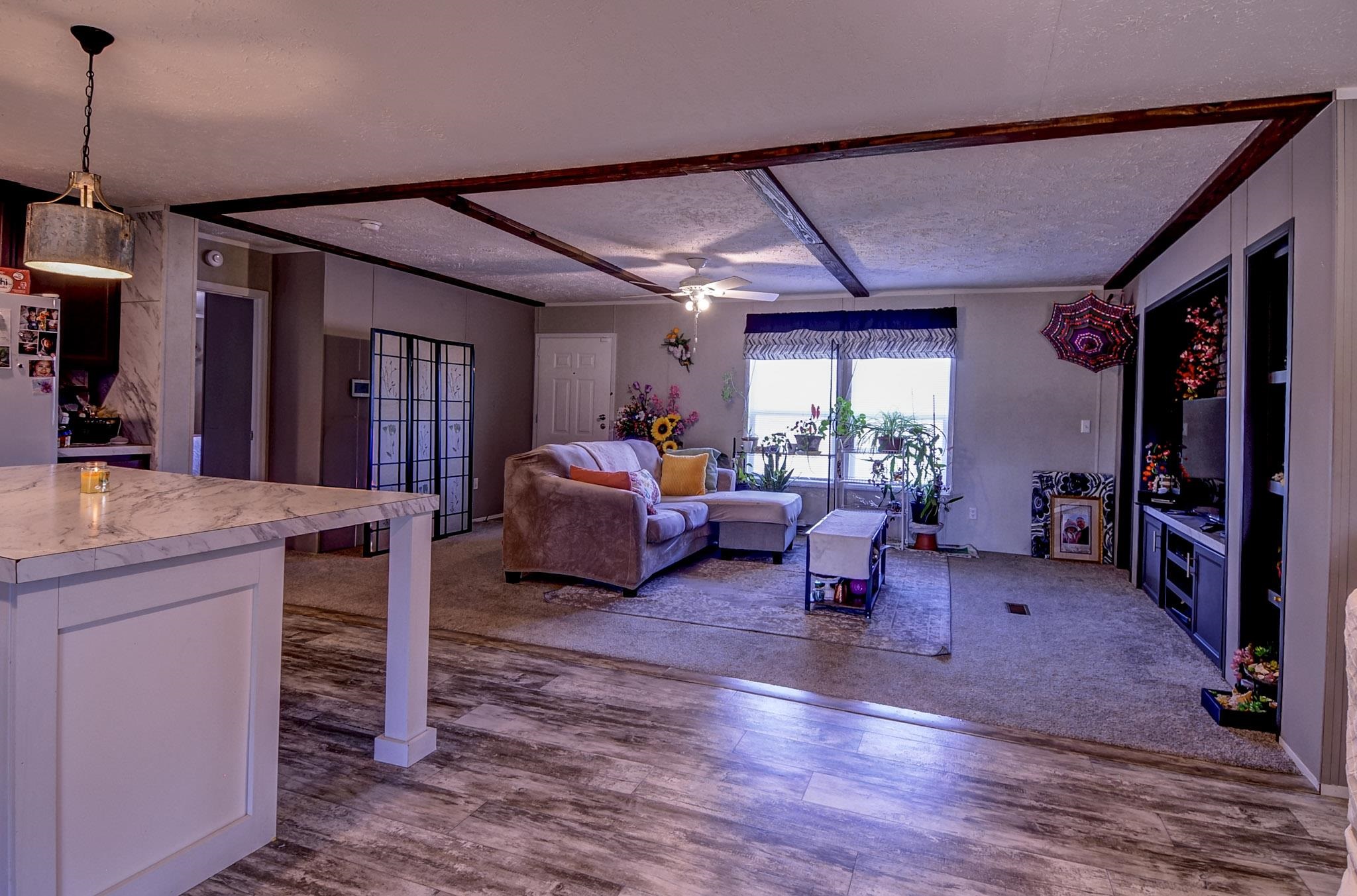 2450 South Neely Road Middleton, TN 38052 - Photo 6 of 38 Living area with dark wood-type flooring, a textured ceiling, and ceiling fan