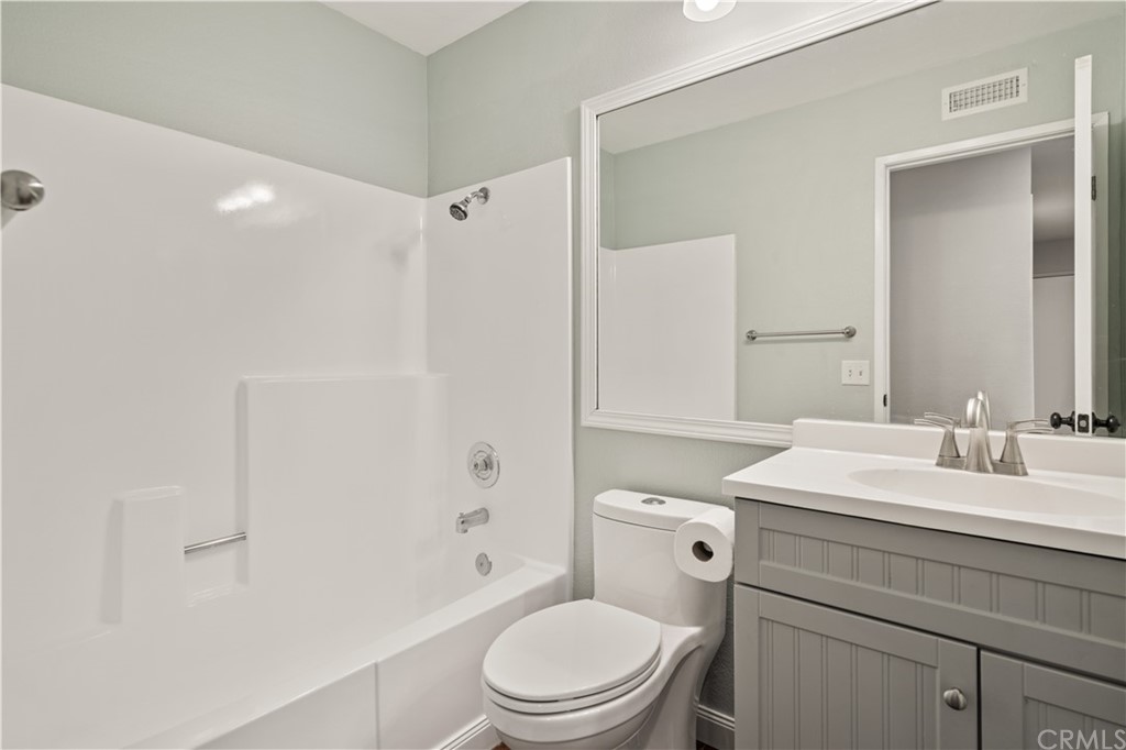 4435 Springtime Drive Oceanside, CA 92056 - Photo 16 of 52 a bathroom with a sink a toilet and shower