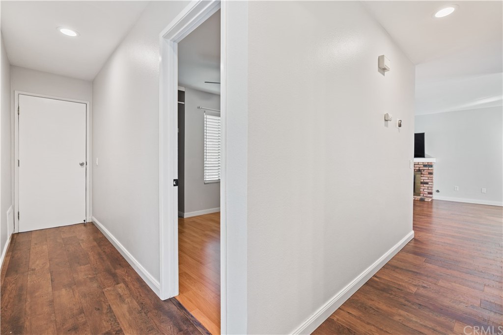 4435 Springtime Drive Oceanside, CA 92056 - Photo 19 of 52 a view of a hallway with wooden floor