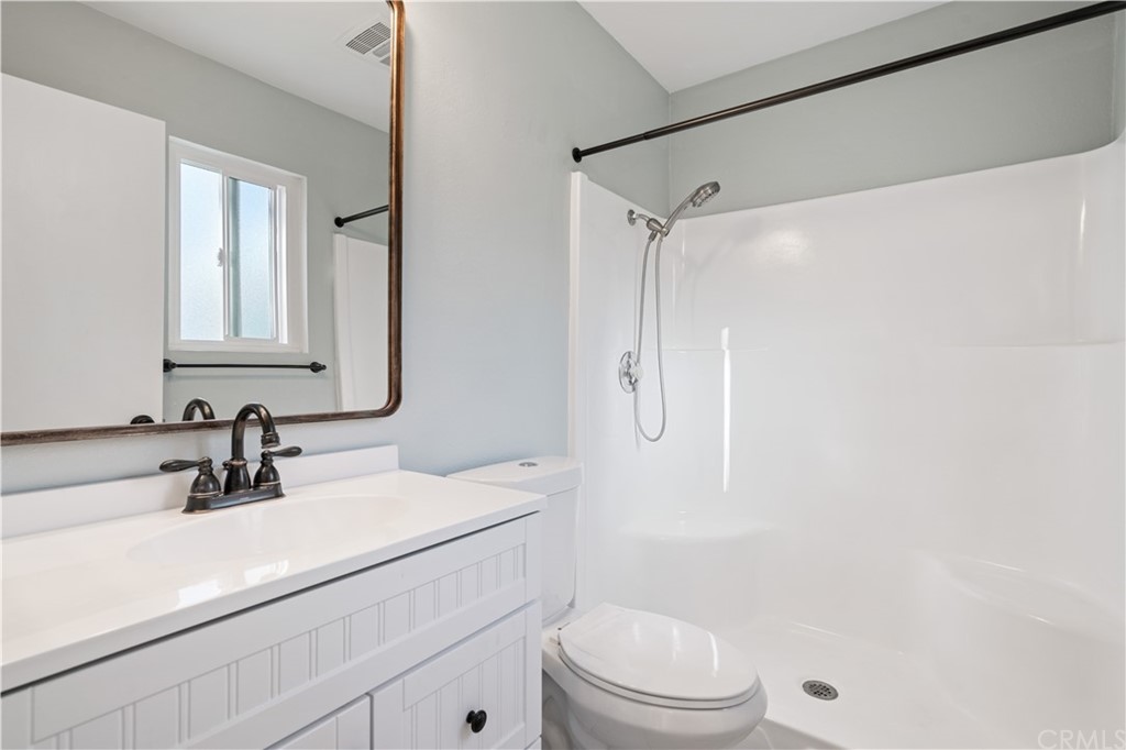 4435 Springtime Drive Oceanside, CA 92056 - Photo 23 of 52 a bathroom with a sink a toilet and shower