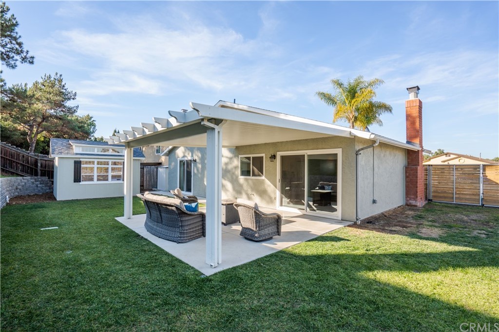 4435 Springtime Drive Oceanside, CA 92056 - Photo 24 of 52 a front view of a house with a garden and porch