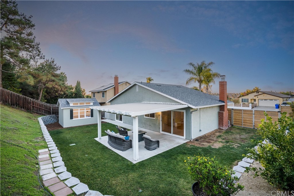 4435 Springtime Drive Oceanside, CA 92056 - Photo 26 of 52 a aerial view of a house with a yard patio and a garden