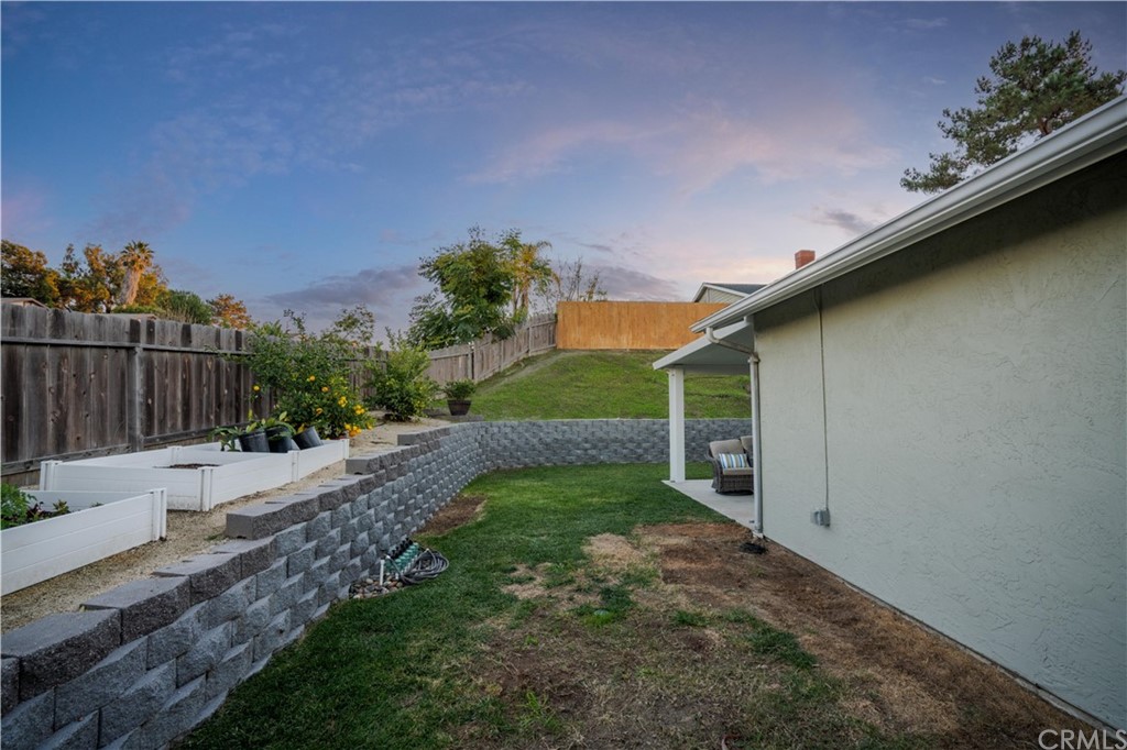 4435 Springtime Drive Oceanside, CA 92056 - Photo 34 of 52 a backyard of a house with lots of green space