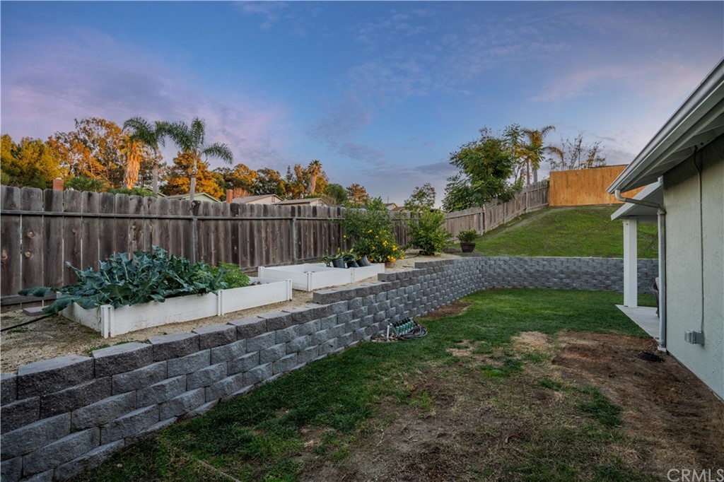 4435 Springtime Drive Oceanside, CA 92056 - Photo 36 of 52 a view of a yard with wooden fence