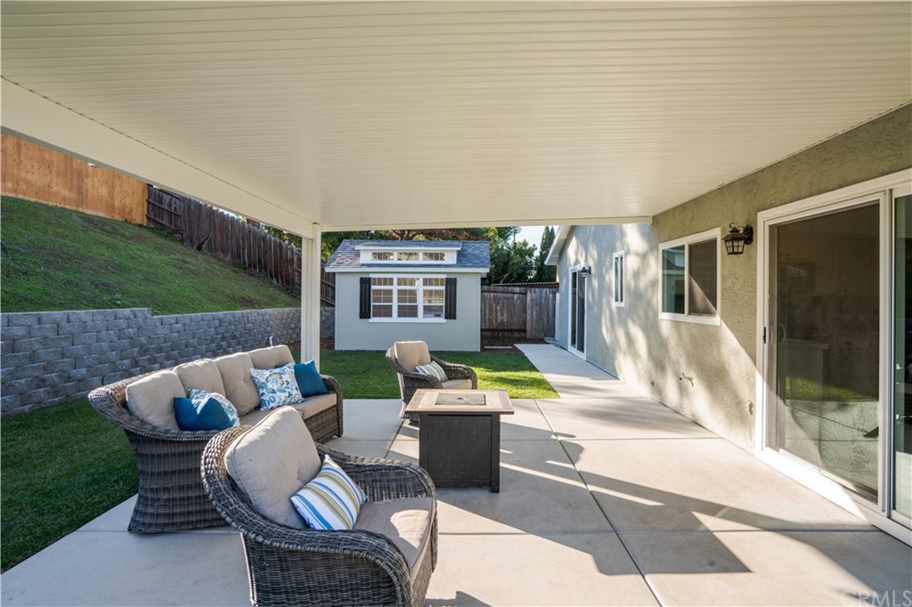 4435 Springtime Drive Oceanside, CA 92056 - Photo 38 of 52 a outdoor living space with furniture and a fireplace