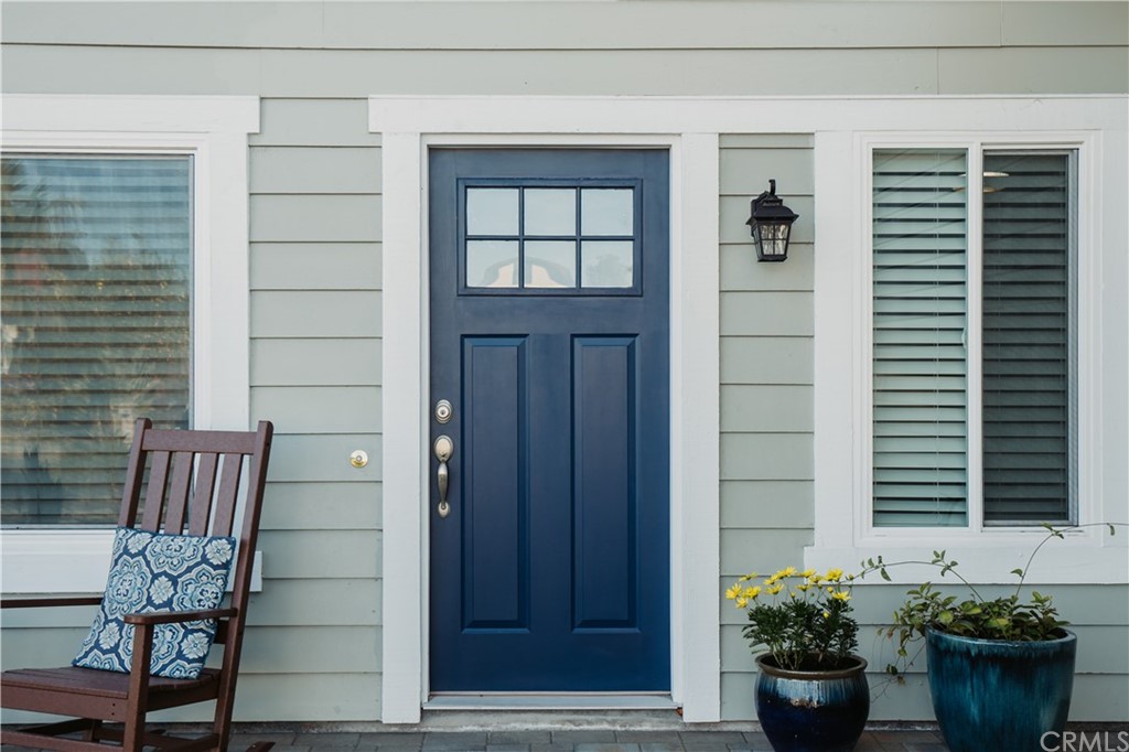 4435 Springtime Drive Oceanside, CA 92056 - Photo 5 of 52 a view of a house with a potted plant and a chair