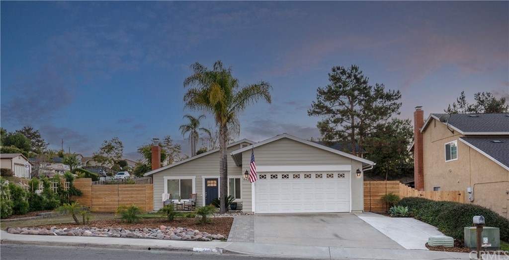 4435 Springtime Drive Oceanside, CA 92056 - Photo 50 of 52 a view of a house with a yard and a garage