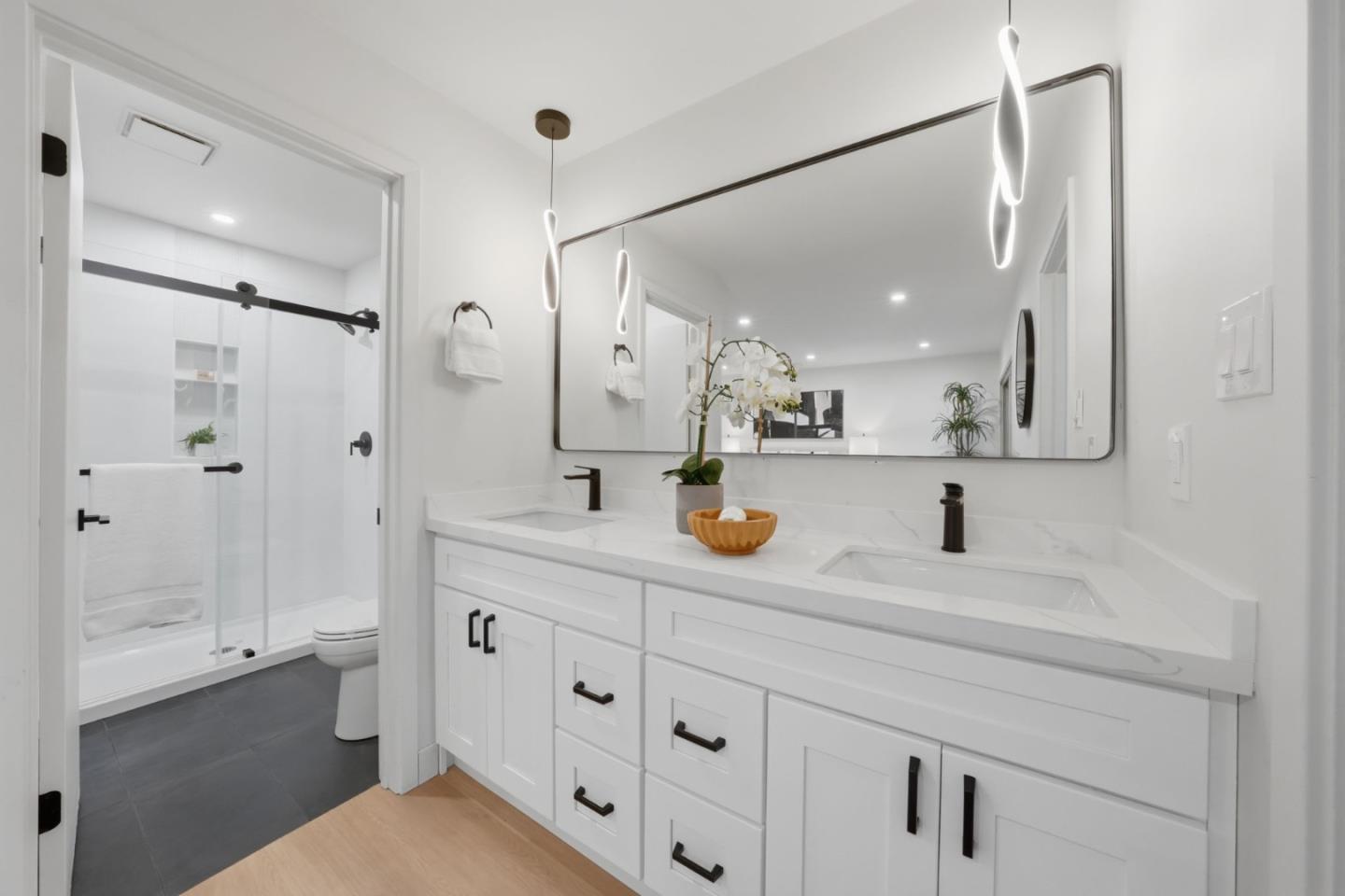409 Puerto Place Hayward, CA 94541 - Photo 31 of 54 a bathroom with a sink double vanity granite tub shower and a mirror