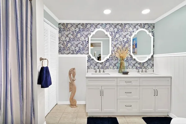 a bathroom with a sink and mirror