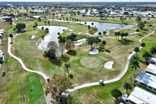 an aerial view of a house with a lake view
