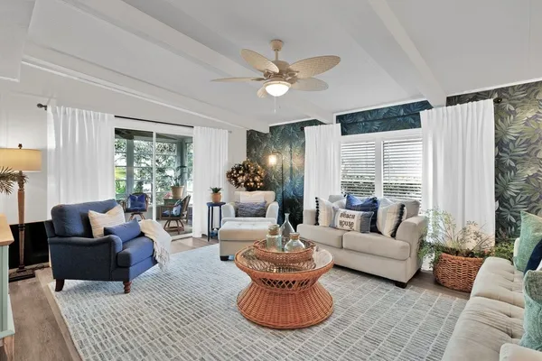a living room with furniture and a large window