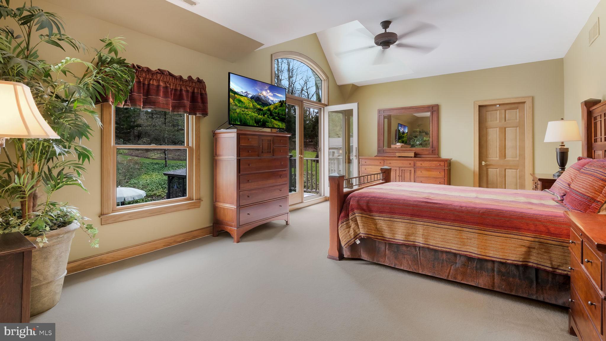 46 Valley Road New Hope, PA 18938 - Photo 26 of 56 a spacious bedroom with a bed dresser and a window