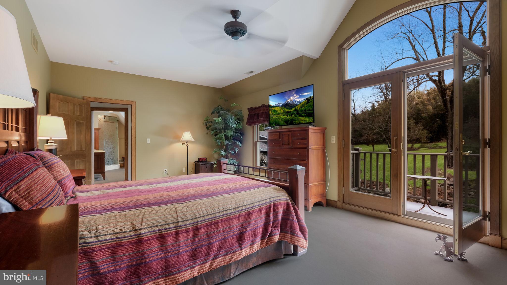 46 Valley Road New Hope, PA 18938 - Photo 27 of 56 a bedroom with a bed and a fireplace