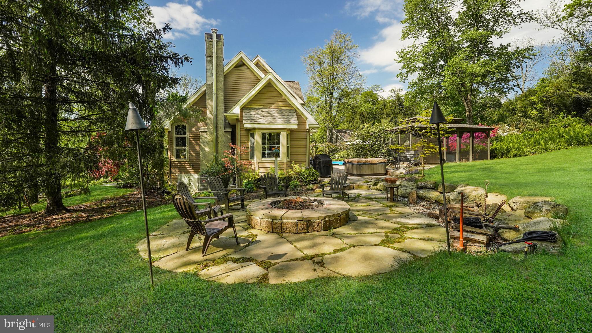 46 Valley Road New Hope, PA 18938 - Photo 40 of 56 a view of backyard of house with outdoor seating and green space
