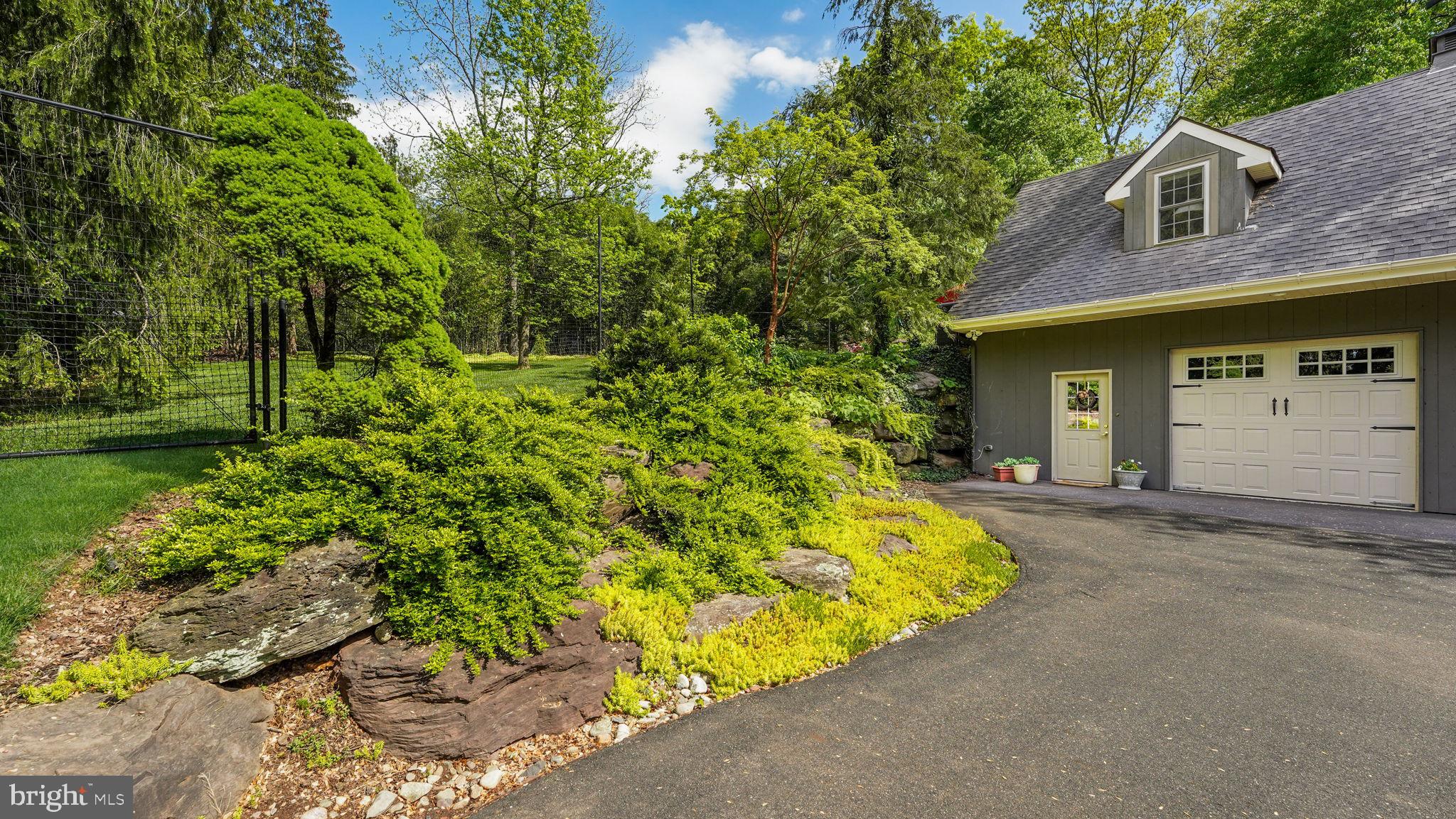 46 Valley Road New Hope, PA 18938 - Photo 42 of 56 a view of a house with a yard and potted plants