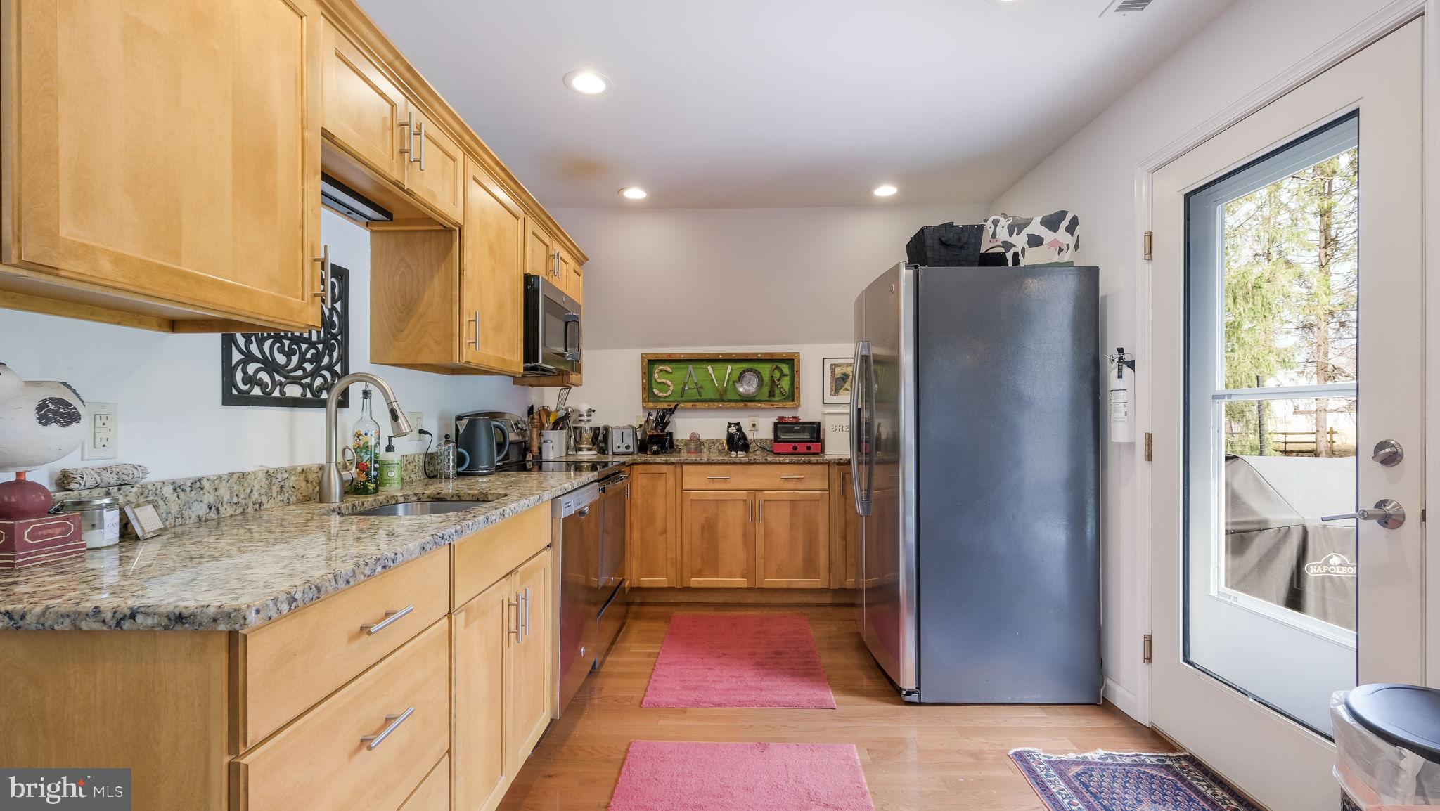 46 Valley Road New Hope, PA 18938 - Photo 49 of 56 a kitchen with stainless steel appliances granite countertop a refrigerator and a sink