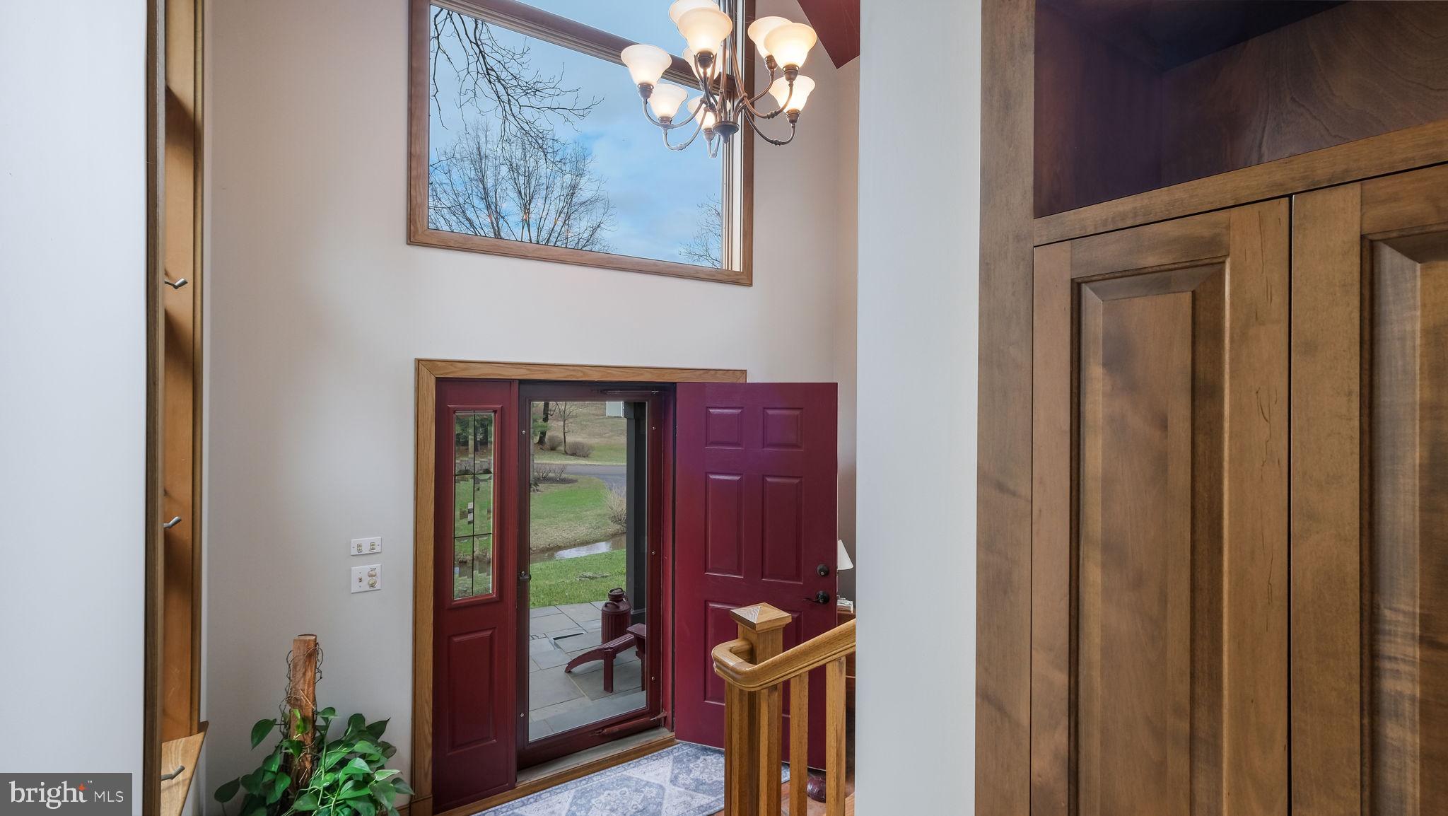 46 Valley Road New Hope, PA 18938 - Photo 8 of 56 a view of a hallway with wooden floor and front door