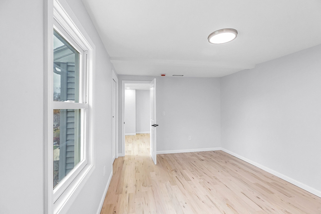 143 James Street Ludlow, MA 01056 - Photo 18 of 41 a view of wooden floor and windows in a room