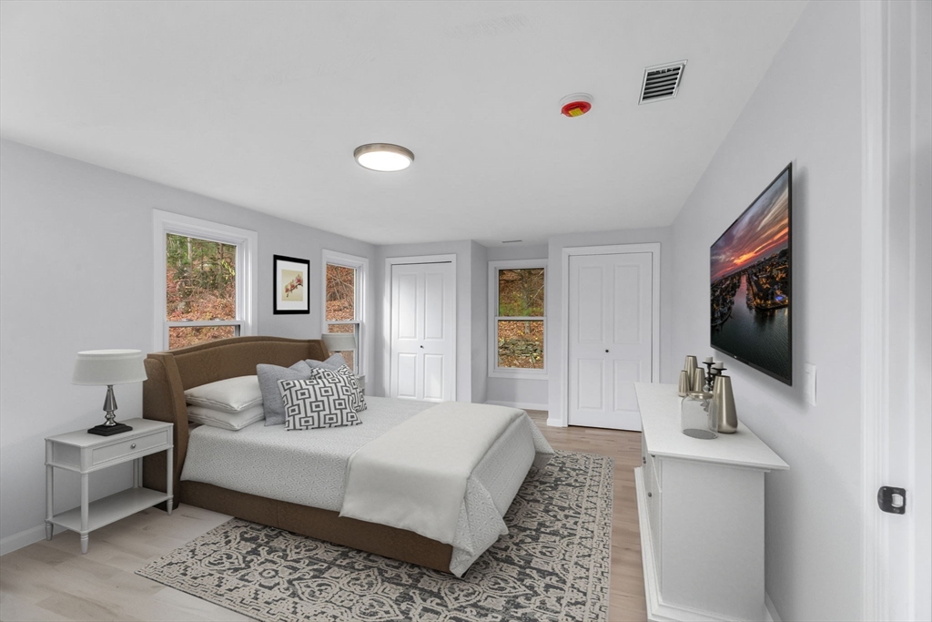 143 James Street Ludlow, MA 01056 - Photo 21 of 41 a bedroom with a large bed and a flat screen tv