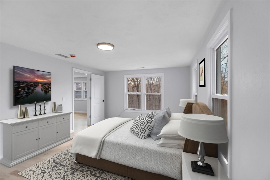 143 James Street Ludlow, MA 01056 - Photo 24 of 41 a bedroom with a bed and a flat screen tv