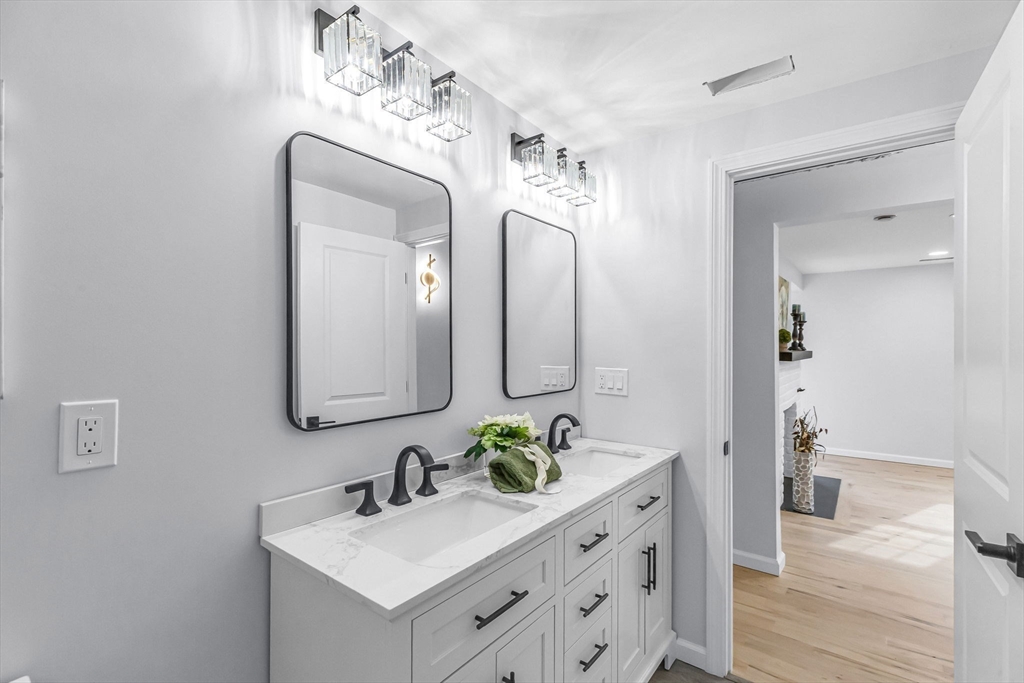143 James Street Ludlow, MA 01056 - Photo 32 of 41 a bathroom with a double vanity sink mirror and shower