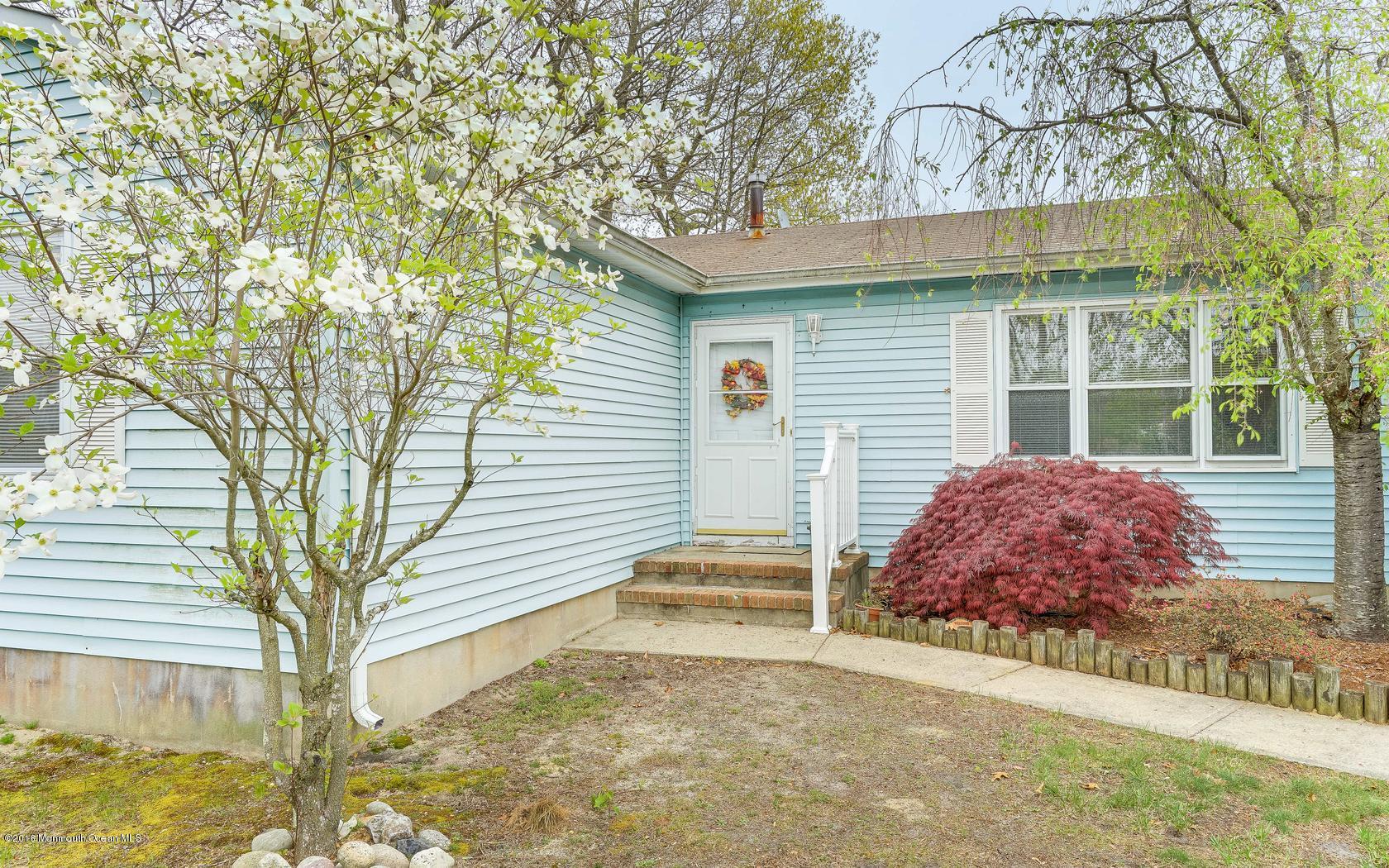 339 Emberly Road Brick, NJ 08723 - Photo 3 of 24 a view of a backyard with large trees