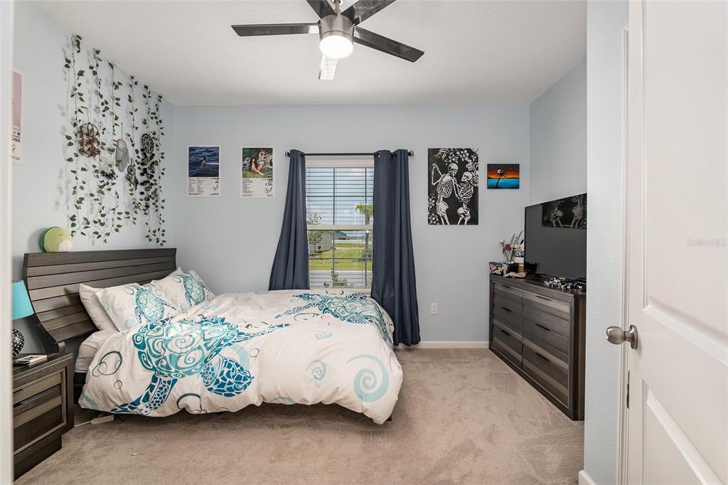 5688 Southwest 92nd Place Ocala, FL 34476 - Photo 34 of 54 a bedroom with a bed and a window