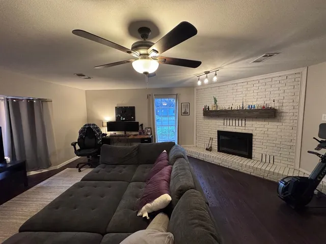 a living room with furniture and a fireplace