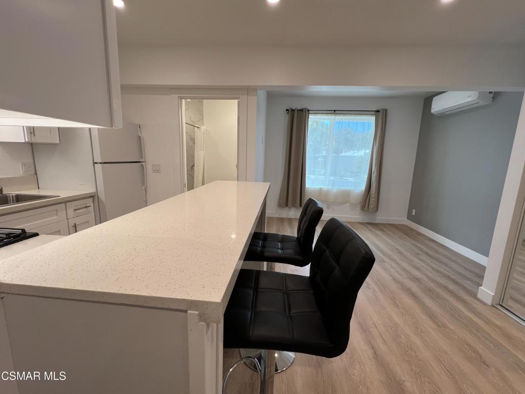 1666 1/2 Stoddard Avenue Thousand Oaks, CA 91360 - Photo 3 of 17 a bed sitting in a bedroom next to a window