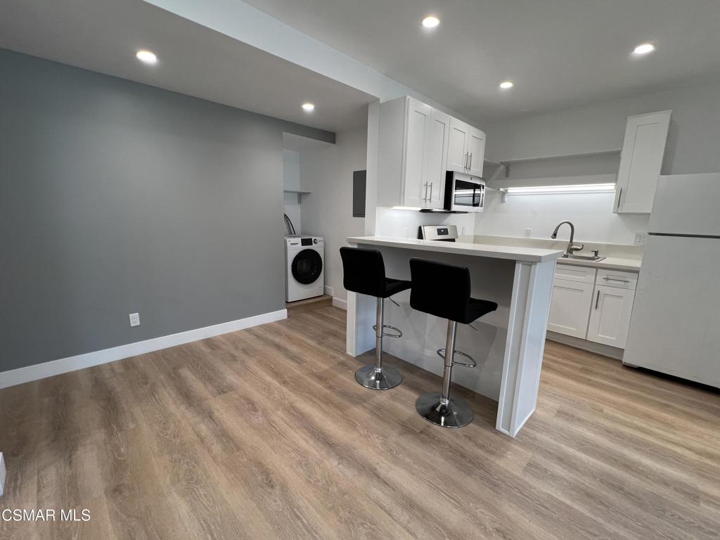 1666 1/2 Stoddard Avenue Thousand Oaks, CA 91360 - Photo 4 of 17 a view of kitchen with microwave and cabinets