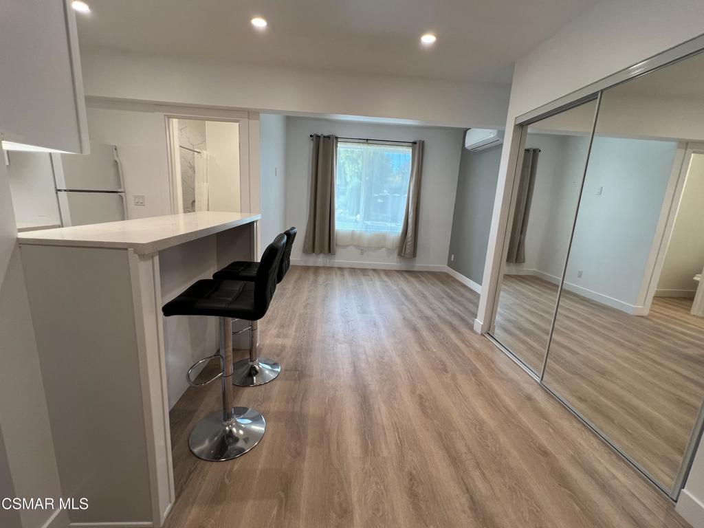 1666 1/2 Stoddard Avenue Thousand Oaks, CA 91360 - Photo 5 of 17 a view of hallway with window and wooden floor