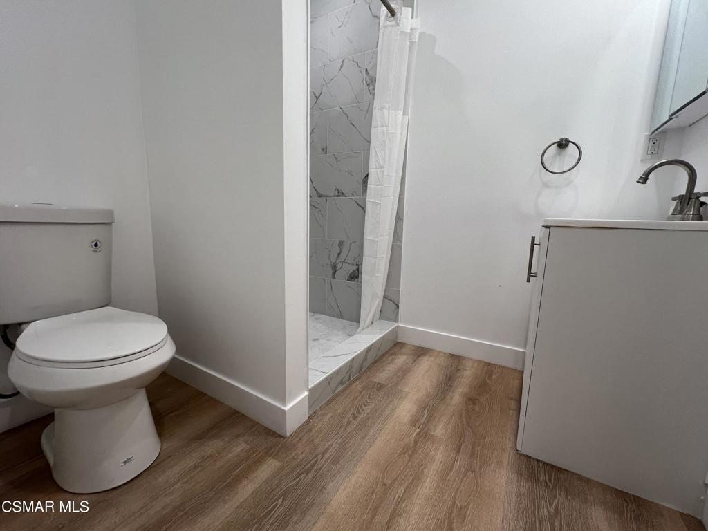 1666 1/2 Stoddard Avenue Thousand Oaks, CA 91360 - Photo 7 of 17 a bathroom with a toilet and a sink