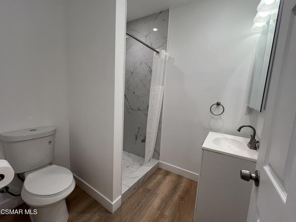 1666 1/2 Stoddard Avenue Thousand Oaks, CA 91360 - Photo 8 of 17 a bathroom with a toilet and a sink