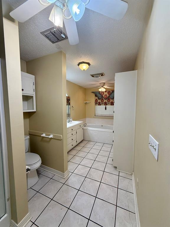11535 Timber Ridge Drive Keithville, LA 71047 - Photo 12 of 39 a bathroom with a sink a toilet and a mirror