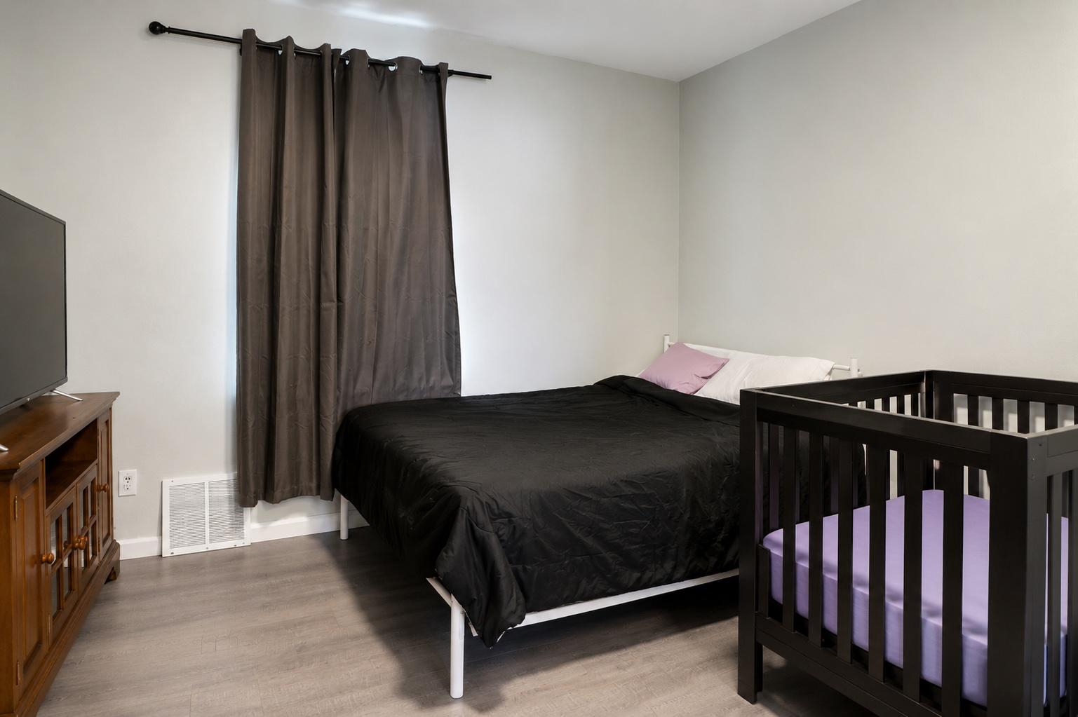 1022 Penn Line Road Paulsboro, NJ 08066 - Photo 5 of 19 a bedroom with a bed and a tv