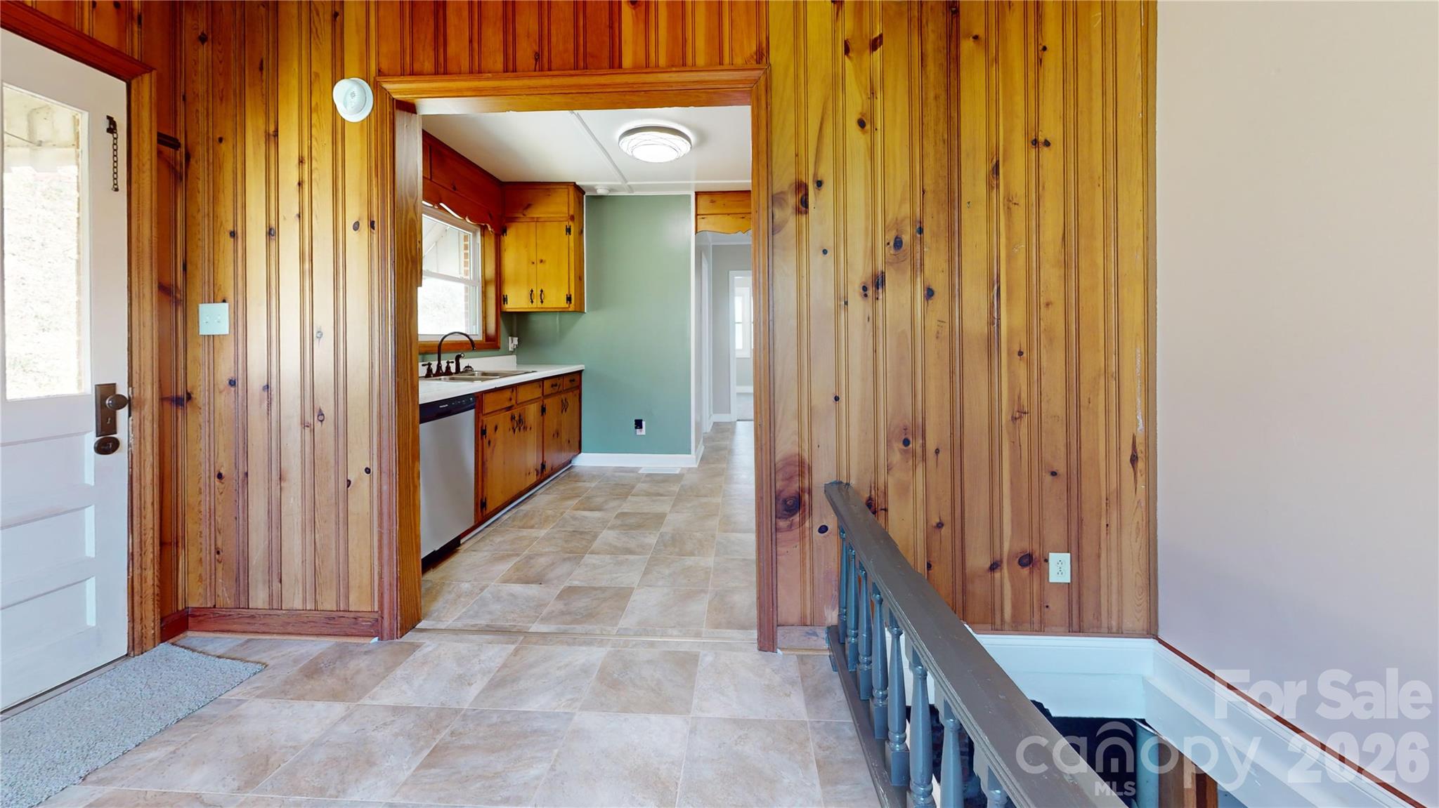 882 Poison Cove Road Clyde, NC 28721 - Photo 16 of 22 a view of a hallway with wooden shelves