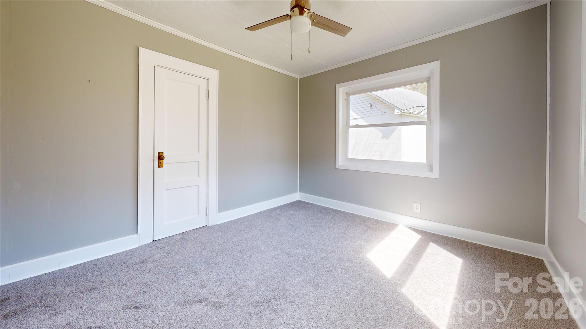 882 Poison Cove Road Clyde, NC 28721 - Photo 17 of 22 an empty room with a window