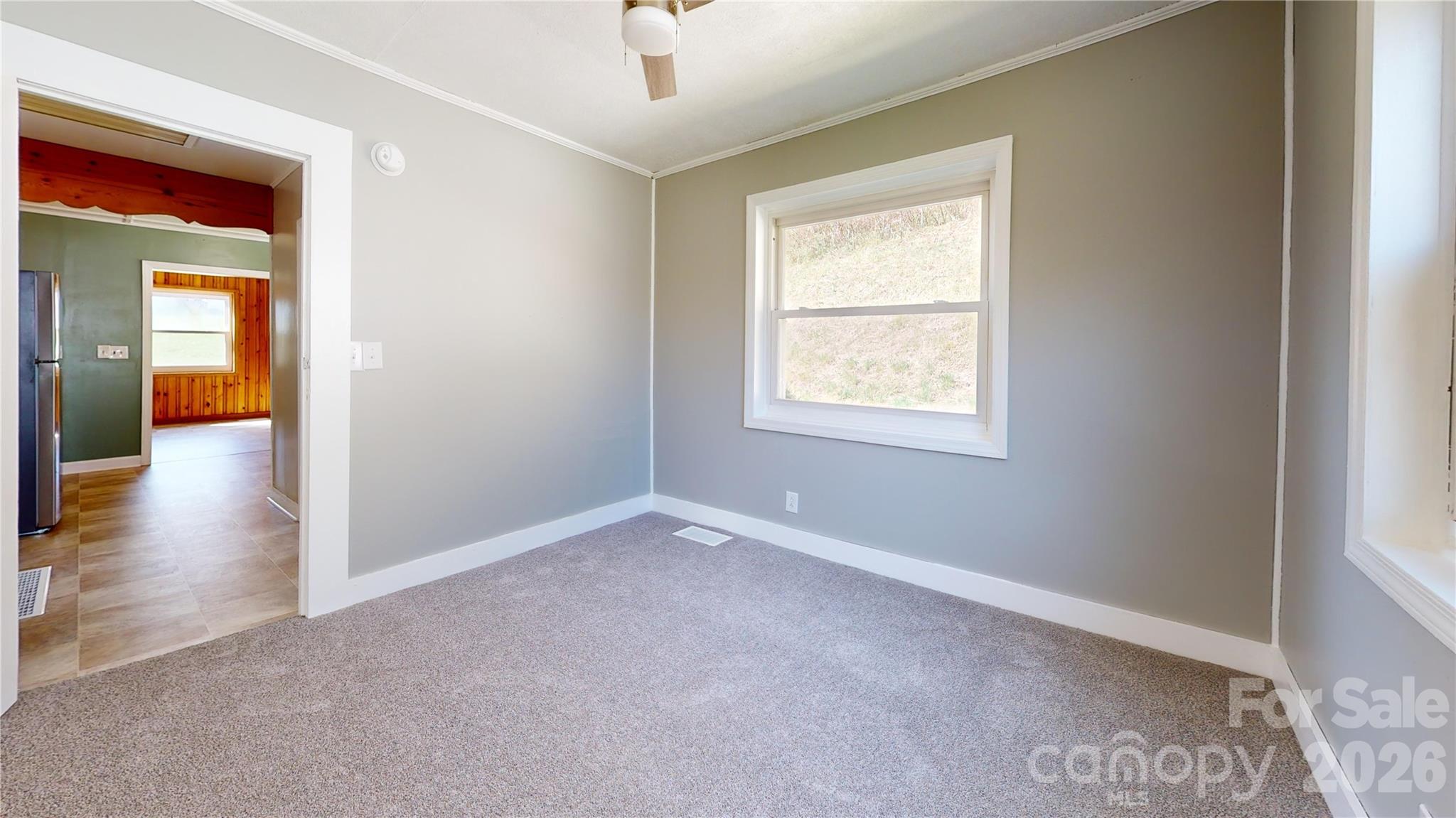 882 Poison Cove Road Clyde, NC 28721 - Photo 20 of 22 an empty room that has a window