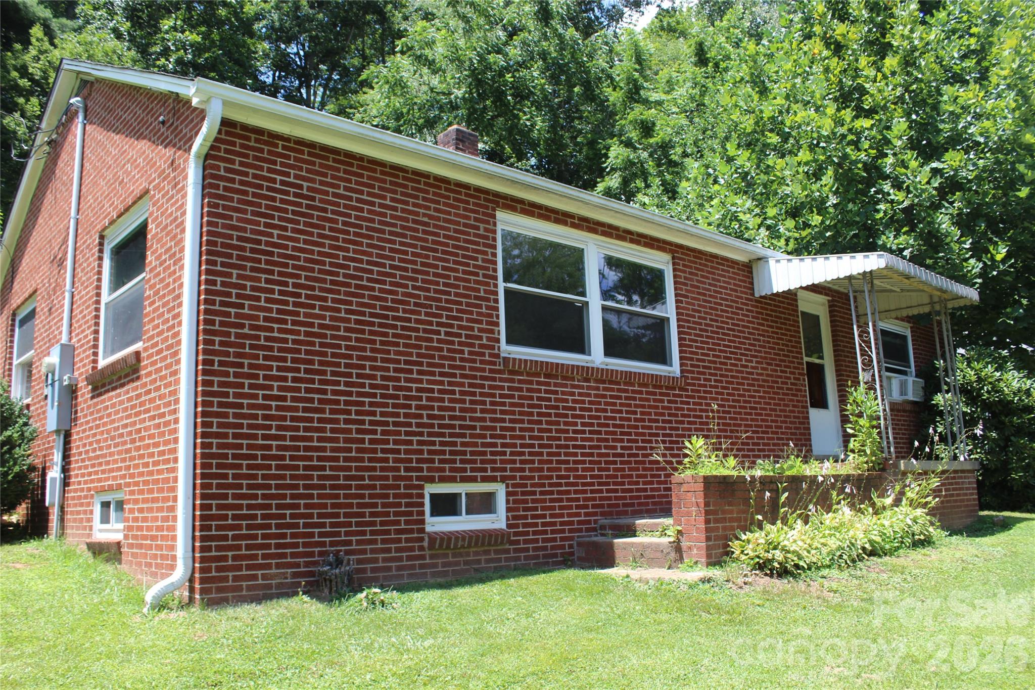 882 Poison Cove Road Clyde, NC 28721 - Photo 2 of 22 a view of backyard with a garden