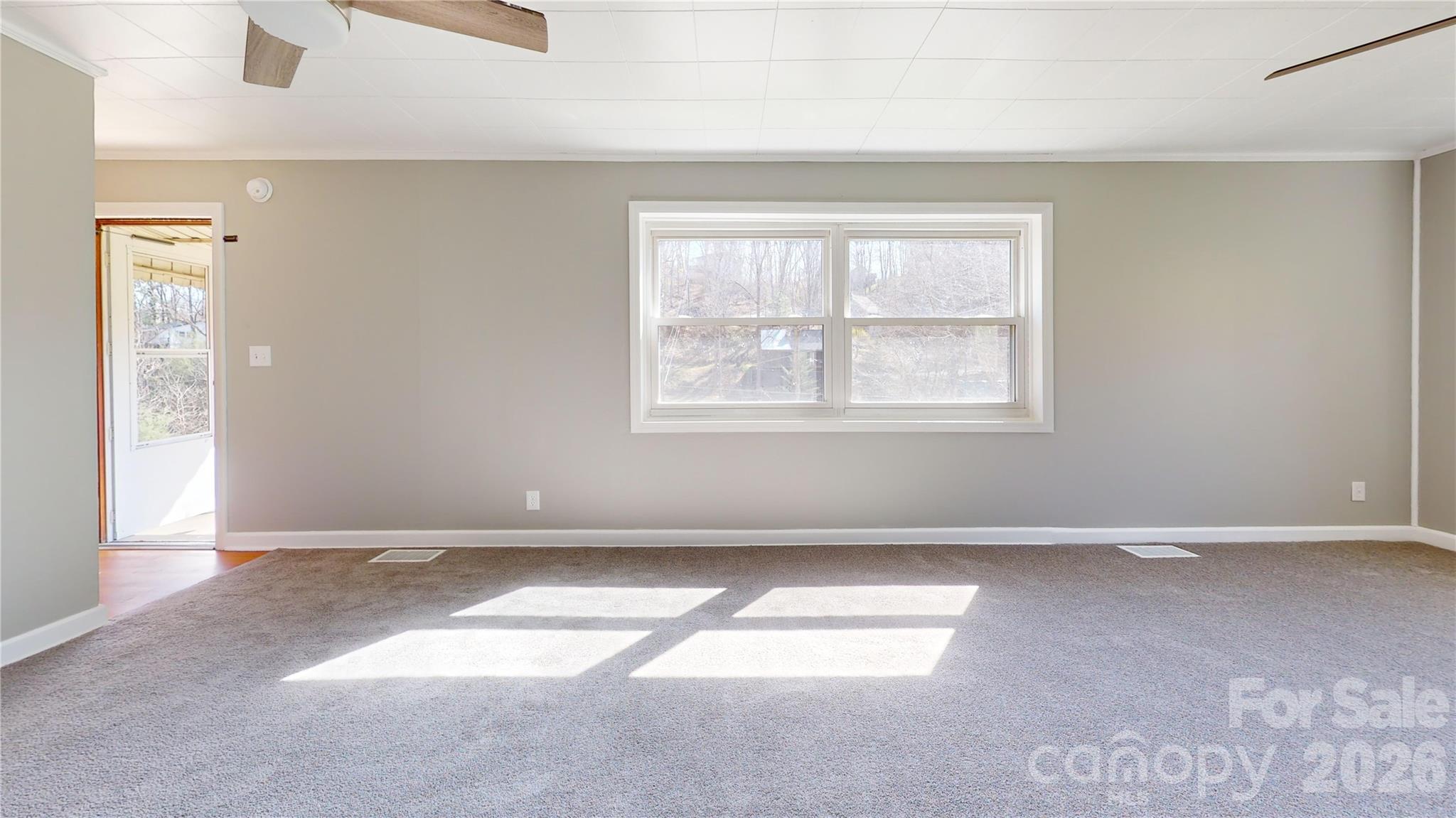 882 Poison Cove Road Clyde, NC 28721 - Photo 9 of 22 an empty room with windows