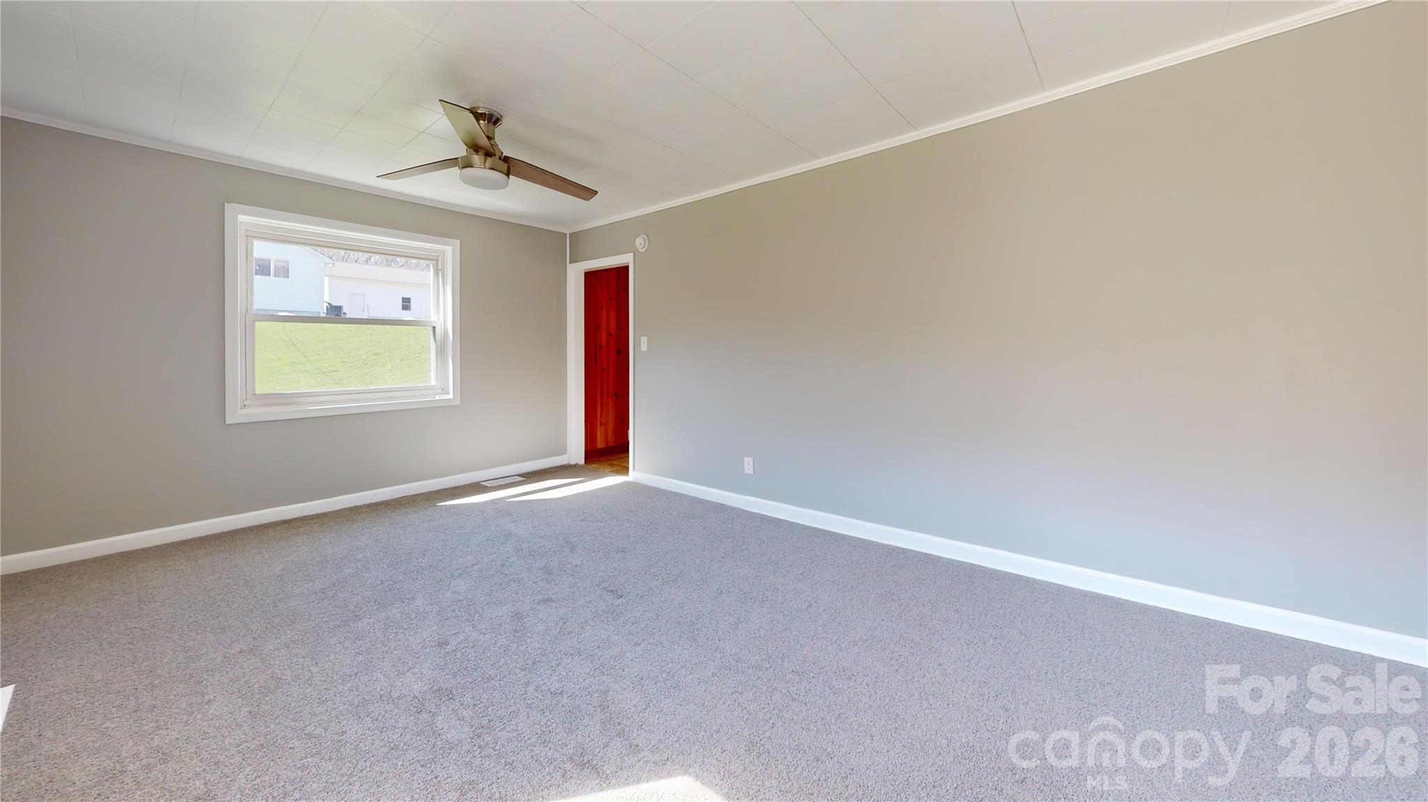882 Poison Cove Road Clyde, NC 28721 - Photo 10 of 22 a view of an empty room with a window